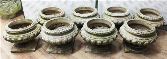 A set of eight Doulton composition stone garden urns, H.1ft 2in. Diam. 1ft 5in.